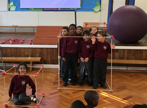 Children in a meter cube and and one child in a small cube