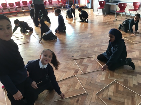 Children tying their ideas out of making 5 squares from 12 rods